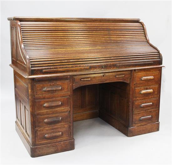 An early 20th century oak roll top desk, W.5ft